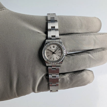 Rolex Ladies Oyster Perpetual 25mm – Silver Dial, Diamond Bezel, Ref. 76080