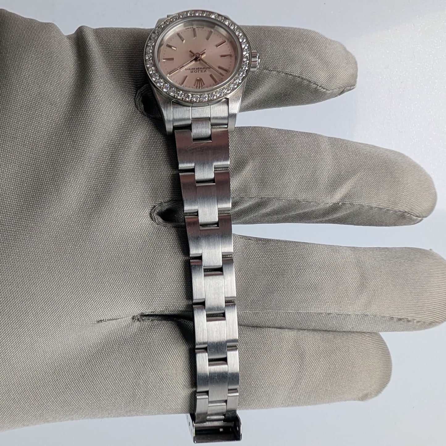 Rolex Ladies Oyster Perpetual 25mm – Silver Dial, Diamond Bezel, Ref. 76080