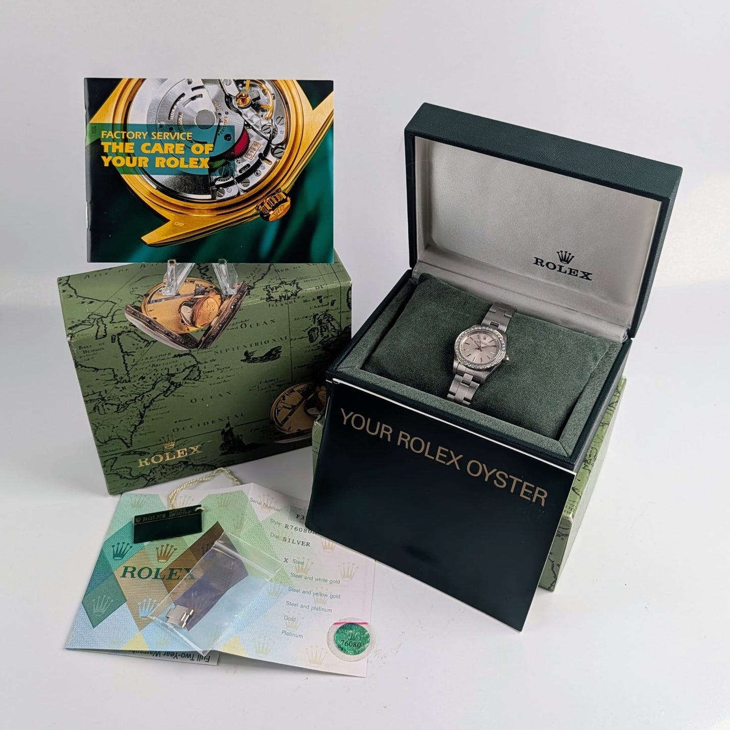 Rolex Ladies Oyster Perpetual 25mm – Silver Dial, Diamond Bezel, Ref. 76080
